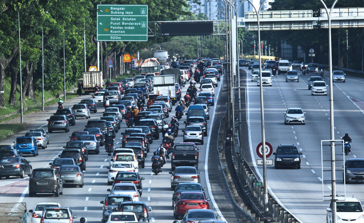 Rows of cars stuck in traffic jams on the highway road at Kuala Lumpur city.