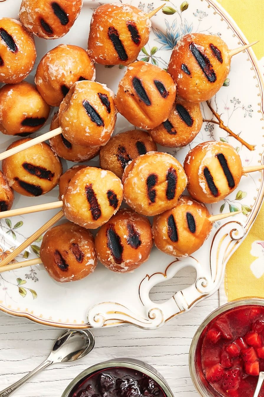 doughnut hole kebabs with strawberry sauce on side