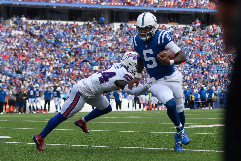 Indianapolis Colts quarterback Anthony Richardson (5) runs against Buffalo Bills cornerback Kaiir Elam during the first half of an NFL preseason football game in Orchard Park, N.Y., Saturday, Aug. 12, 2023. (AP Photo/Adrian Kraus)