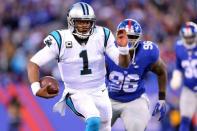 Dec 20, 2015; East Rutherford, NJ, USA; Carolina Panthers quarterback Cam Newton (1) runs with the ball against the New York Giants during the fourth quarter at MetLife Stadium. Mandatory Credit: Brad Penner-USA TODAY Sports