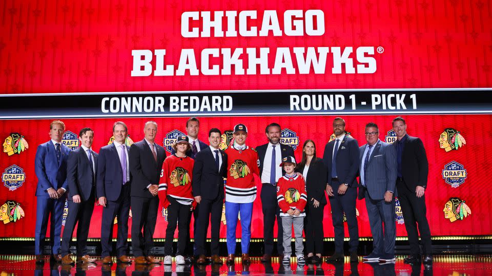 Bedard (center) was selected by the Blackhawks with the first overall pick of the NHL Draft.  - Bruce Bennett/Getty Images