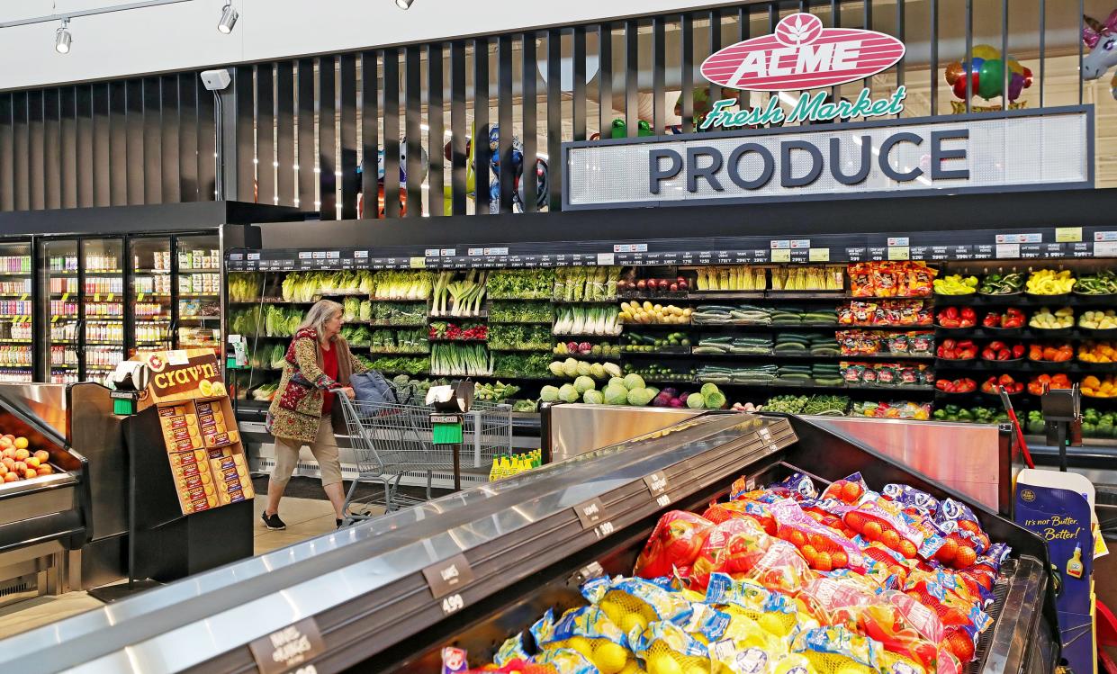 Customers shop in the newly renovated produce section of Acme Fresh Market, Tuesday, Oct. 10, 2023, in Hudson, Ohio.