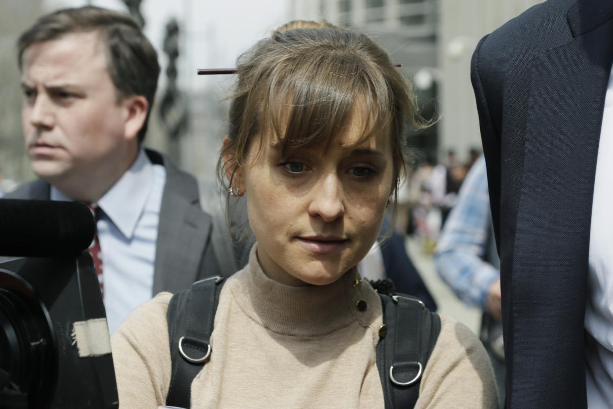 Actress Allison Mack leaves Brooklyn federal court Monday, April 8, 2019, in New York. Mack pleaded guilty to racketeering charges on Monday in a case involving a cult-like group based in upstate New York. The trial is expected to detail sensational allegations that the group, called NXIVM, recruited sex slaves for its spiritual leader, Keith Raniere.(AP Photo/Mark Lennihan)