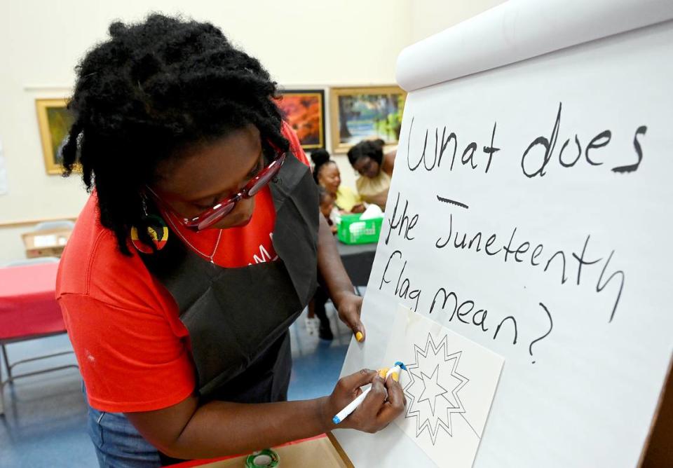 Dr. Sharon Jefferson, President of the Rosalyn Walton Education and Enrichment Services, Inc., leads activities for children Friday.