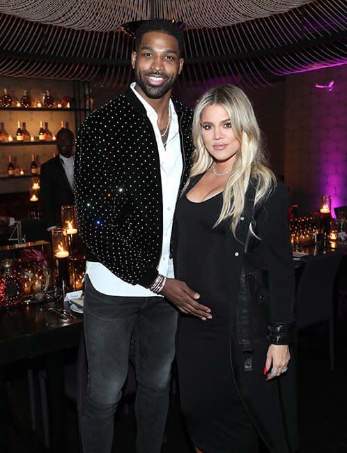Tristan and Khloe pictured at a party in 2018