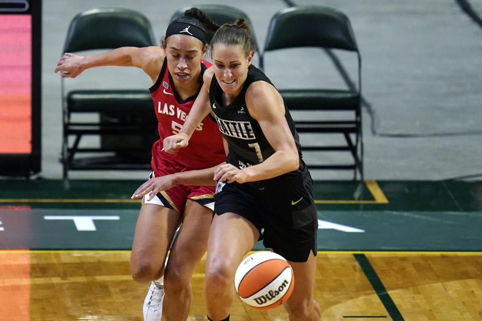 Seattle Storm's Stephanie Talbot (7) beats Las Vegas Aces' Dearica Hamby to a loose ball in the first half of a WNBA basketball game Saturday, May 15, 2021, in Everett, Wash. (AP Photo/Elaine Thompson)