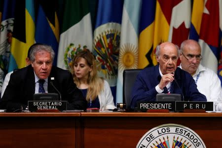 Peru's Foreign Relations Minister Ricardo Luna Mendoza (R) speaks on the sideline of the OAS 47th General Assembly as Organization of American States (OAS) Secretary General Luis Almagro looks on in Cancun, Mexico June 20, 2017. REUTERS/Carlos Jasso