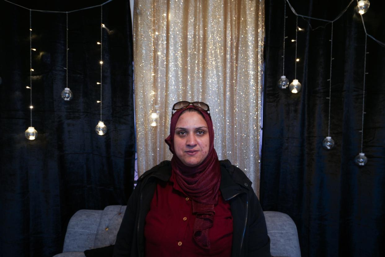 Suzi Ibrahim Bozom moved to the West Bank in 2011 and hasn't seen her family back in Gaza in years. She currently lives in the West Bank, miles away from her home and family members that have been impacted by the war. Bozom said she calls her family members multiple times a day - and is scared when it rings. She said her father was killed in an airstrike.