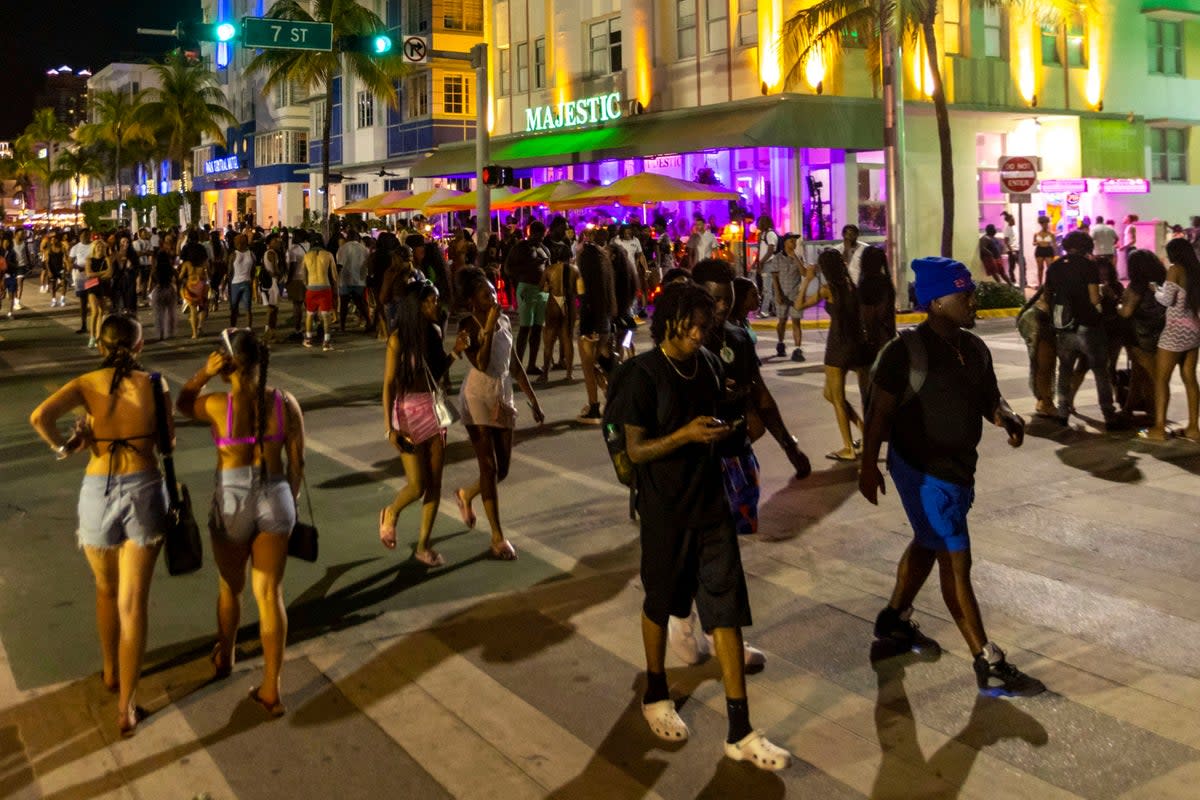 Crowds walk up and down Ocean Drive during spring break (AP)