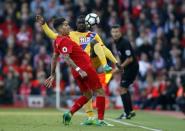 Britain Football Soccer - Liverpool v Crystal Palace - Premier League - Anfield - 23/4/17 Crystal Palace's Jeffrey Schlupp in action with Liverpool's Roberto Firmino Action Images via Reuters / Paul Childs Livepic