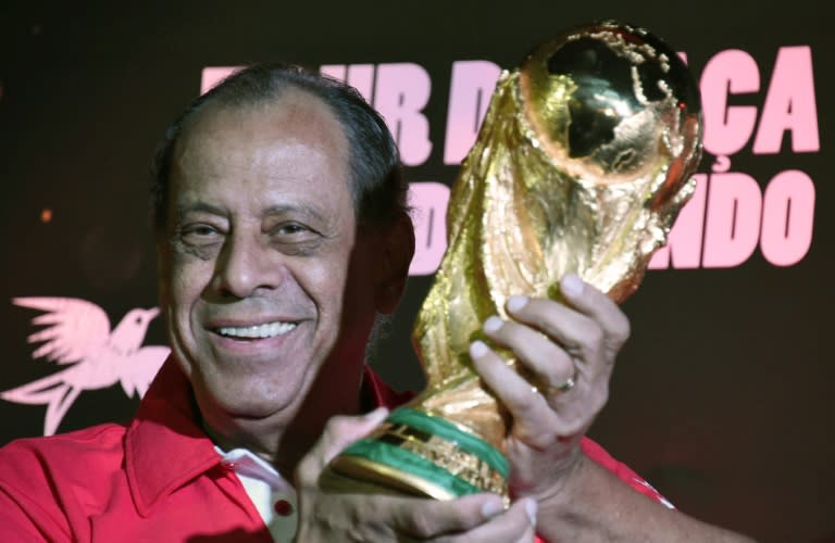 Carlos Alberto, former captain of the Brazilian 1970's football team, holds the World Cup which has just arrived in the country, at Maracana stadium in Rio de Janeiro, Brazil in 2014