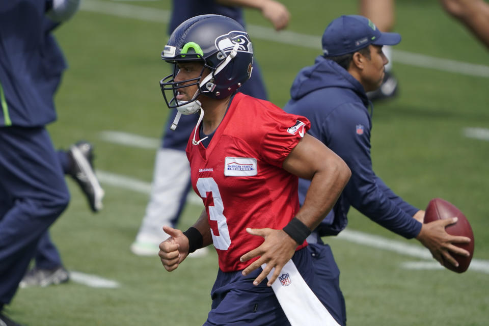 Seattle Seahawks quarterback Russell Wilson runs during NFL football practice Tuesday, June 8, 2021, in Renton, Wash. (AP Photo/Ted S. Warren)