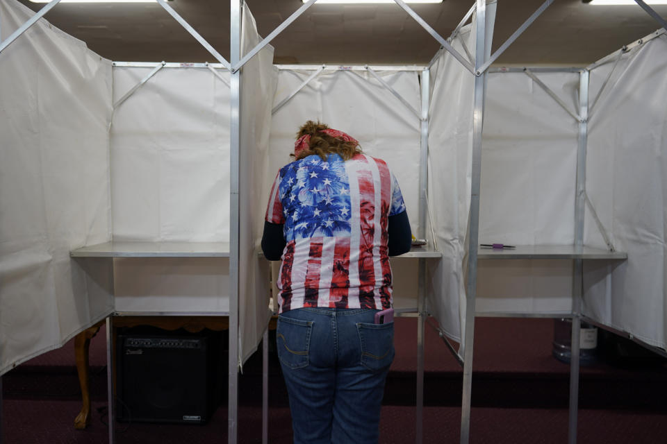 Loretta Myers fills out her ballot at her polling place, the New LIFE Worship Center Church of God, in Fayetteville, Pa., Tuesday, Nov. 8, 2022. (AP Photo/Carolyn Kaster)