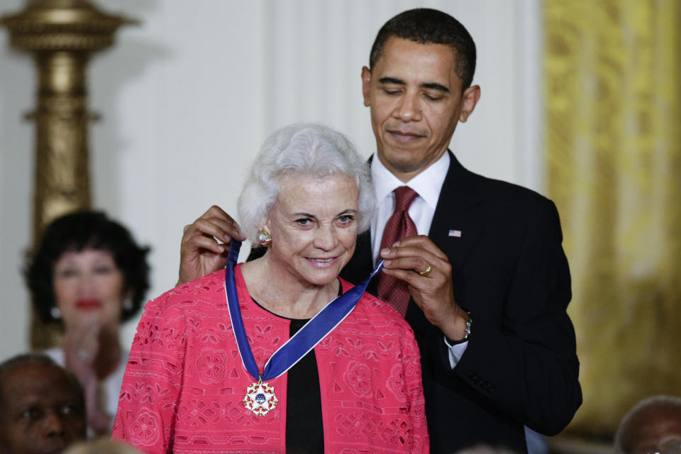 FILE - President Barack Obama presents the 2009 Presidential Medal of Freedom to Sandra Day O'Connor, Aug. 12, 2009. The late Justice Sandra Day O'Connor, the first woman to serve on the Supreme Court and an unwavering voice of moderate conservatism for more than two decades, will lie in repose in the court's Great Hall on Monday, Dec. 18, 2023. (AP Photo/J. Scott Applewhite, File)