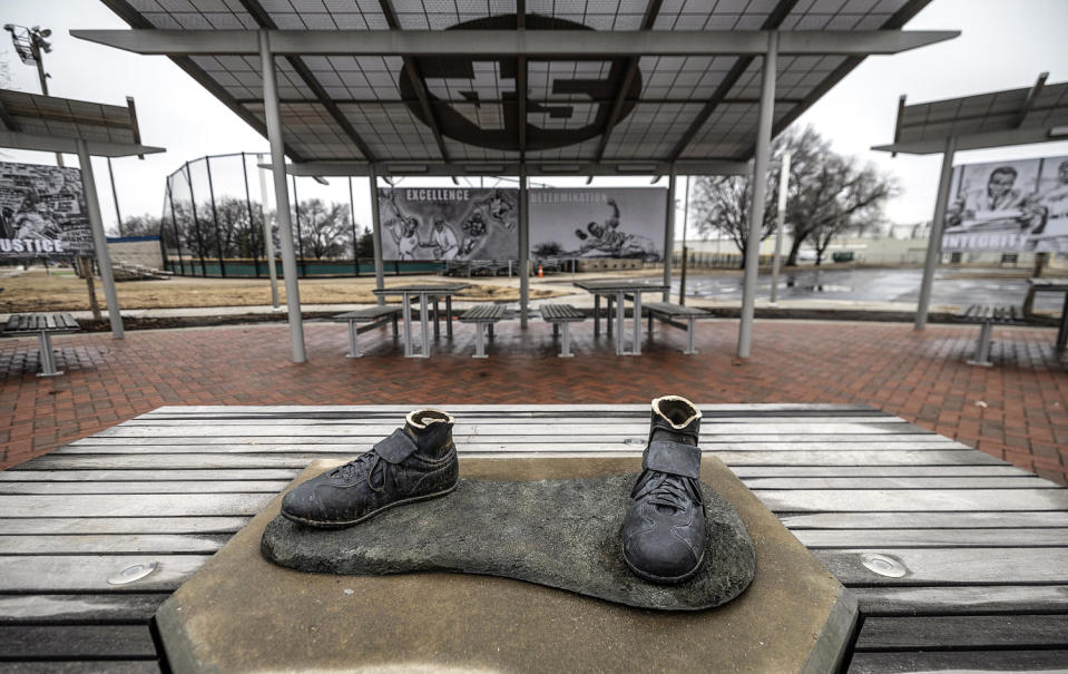 A bronze statue of legendary baseball pioneer Jackie Robinson was stolen from a park in Wichita, Kan., (Travis Heying / The Wichita Eagle via AP)