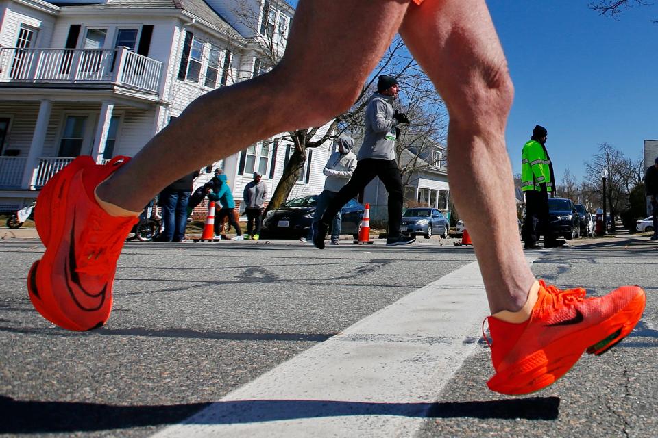 Runners make their way up Rockdale Avnue during the 2023 New Bedford Half-Marathon.