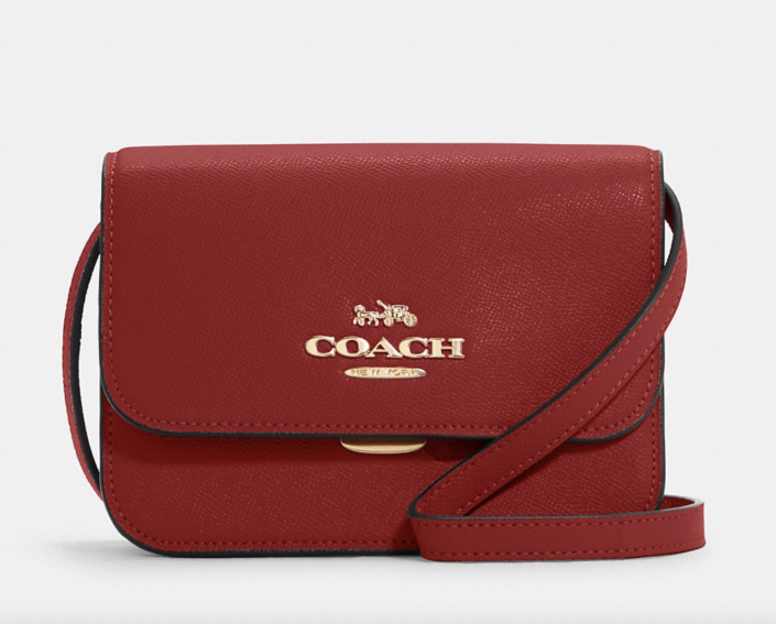 Mini Brynn Crossbody in red leather with gold lettering (Photo via Coach Outlet)