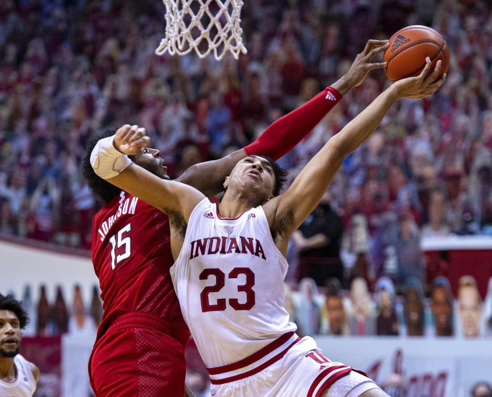 Indiana forward Trayce Jackson-Davis, right, has his shot attempt blocked by Rutgers center Myles Johnson, left, during the second half of an NCAA college basketball game, Sunday, Jan. 24, 2021, in Bloomington, Ind. (AP Photo/Doug McSchooler)