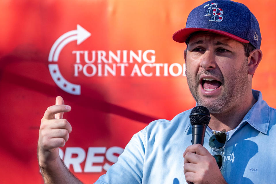 Tyler Bowyer, chief operating officer of Turning Point Action, speaks during a Turning Point Action rally at Pioneer Park in Mesa on Oct. 1, 2022.