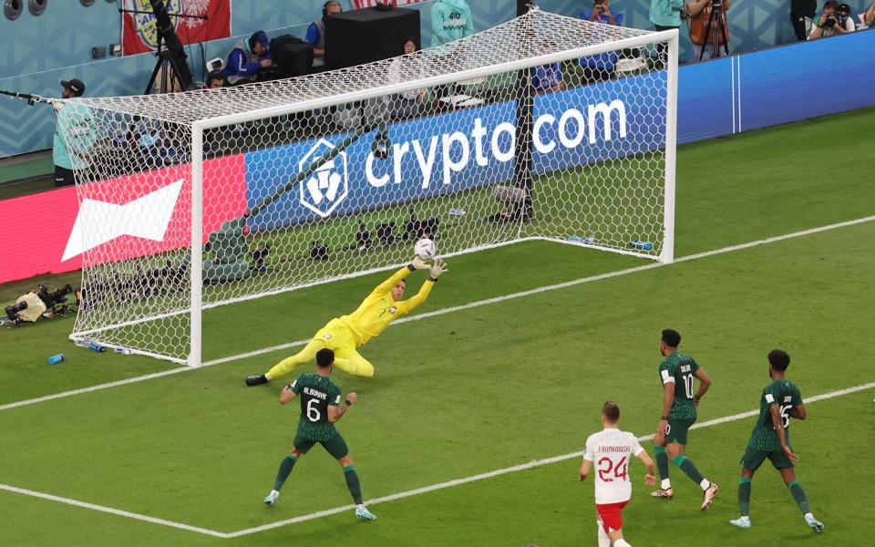 Soccer Football - FIFA World Cup Qatar 2022 - Group C - Poland v Saudi Arabia - Education City Stadium, Al Rayyan, Qatar - November 26, 2022 Poland's Wojciech Szczesny saves from Saudi Arabia's Mohammed Al Burayk - REUTERS/Molly Darlington