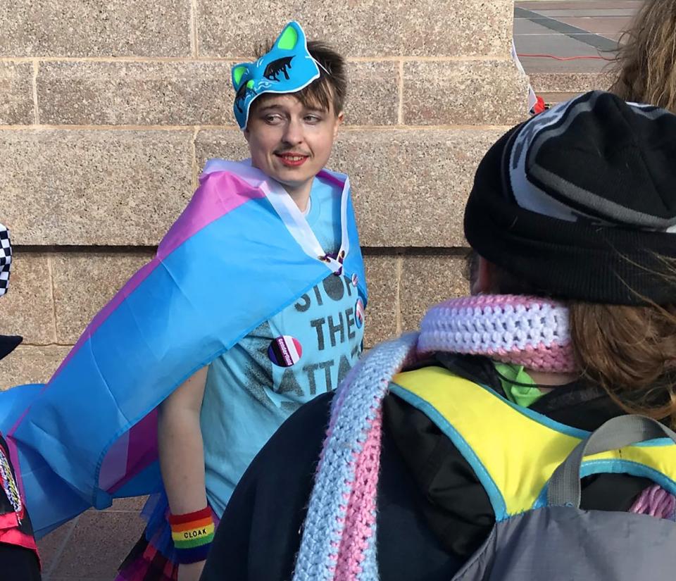 Shay Wilson stands among other transgender Oklahomans and allies at a rally in support of trans people on the south plaza of the state Capitol.