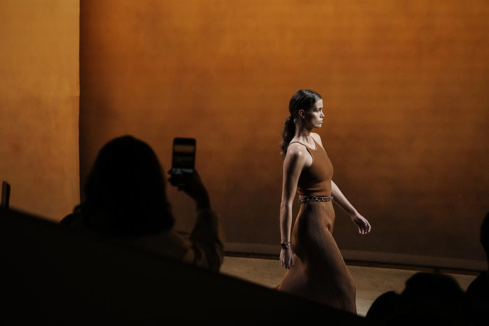 A model wears a creation for the Hermes Spring-Summer 2022 ready-to-wear fashion show presented Saturday, Oct. 2, 2021, in Paris. (AP Photo/Thibault Camus)