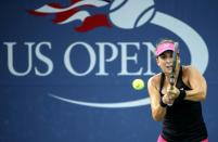 Belinda Bencic returns to Sesil Karatantcheva during their US Open match at the USTA Billie Jean King National Tennis Center on August 31, 2015