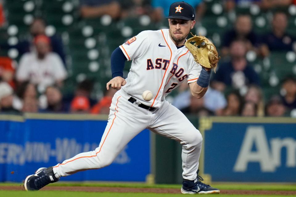 Astros third baseman Alex Bregman fields a grounder by Guardians outfielder Myles Straw, who was out at first during the third inning of Tuesday night's game. The Astros won 7-3. [Eric Christian Smith/Associated Press]