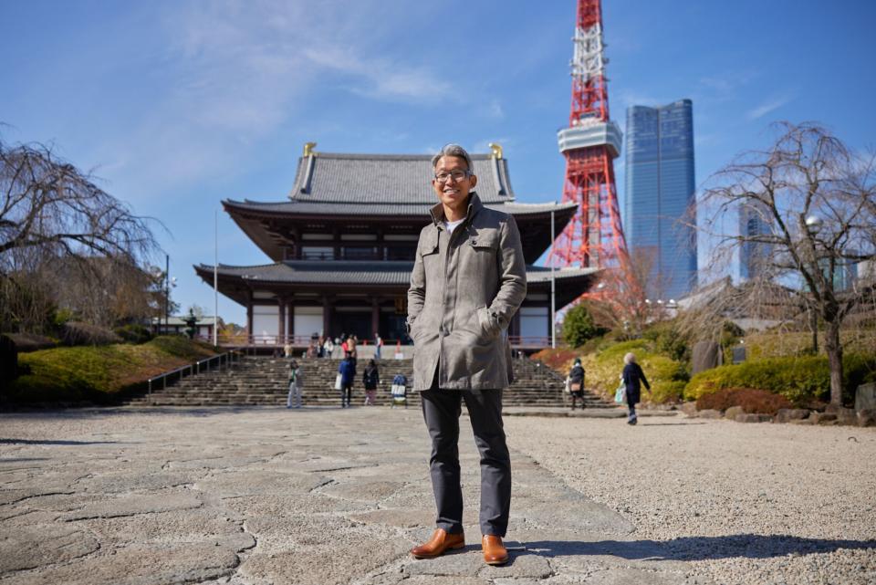Hisayuki Idekoba in front of the Zojoji temple and Tokyo Tower. Photographer: Shoko Takayasu/Bloomberg