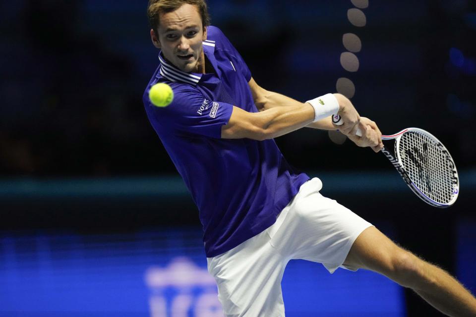 Danil Medvedev of Russia returns the ball to Hubert Hurkaz of Poland during their ATP World Tour Finals singles tennis match, at the Pala Alpitour in Turin, Sunday, Nov. 14, 2021. (AP Photo/Luca Bruno)