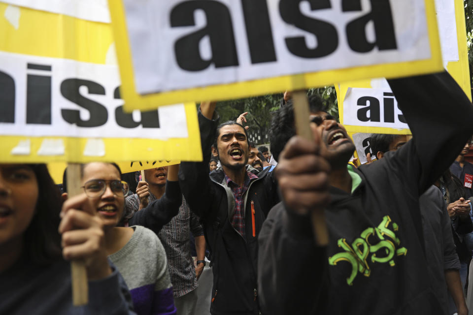 Indian students shout slogans during a protest march towards the Parliament in New Delhi, India, Saturday, Nov. 23, 2019. Hundreds of students of the Jawaharlal Nehru University were joined by students from other universities, activists and members of civil society as they marched towards India's parliament to protest against the hostel fee hike, along with their other demands. (AP Photo/Altaf Qadri)