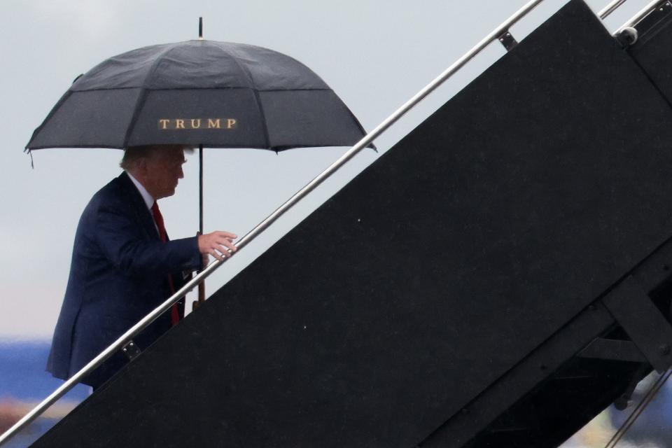 Former U.S. President Donald Trump boards his plane at Reagan National Airport following an arraignment in Washington, D.C. federal court on August 3, 2023 in Arlington, Virginia. Trump pleaded not guilty to four felony criminal charges during his arraignment this afternoon after being indicted for his alleged efforts to overturn the 2020 election.