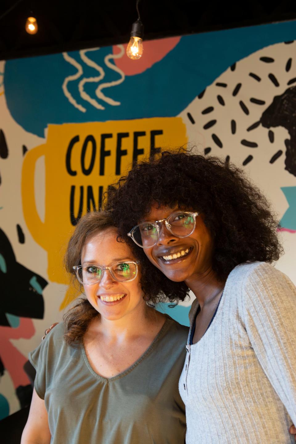 Coffee Underground owner Kelly Ellenburg (left) and manager Nayeema Hoffman pose for a portrait in the coffee shop.