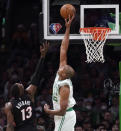 Boston Celtics center Al Horford, right, blocks a shot by Miami Heat center Bam Adebayo (13) during the second half of Game 4 of the NBA basketball playoffs Eastern Conference finals, Monday, May 23, 2022, in Boston. (AP Photo/Charles Krupa)
