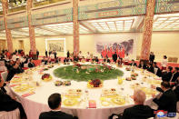 <p>North Korean leader Kim Jong Un and wife Ri Sol Ju, and Chinese President Xi Jinping and wife Peng Liyuan attend a banquet in Beijing, China, in this undated photo released by North Korea’s Korean Central News Agency (KCNA) in Pyongyang, March 28, 2018. (Photo: KCNA/via Reuters) </p>