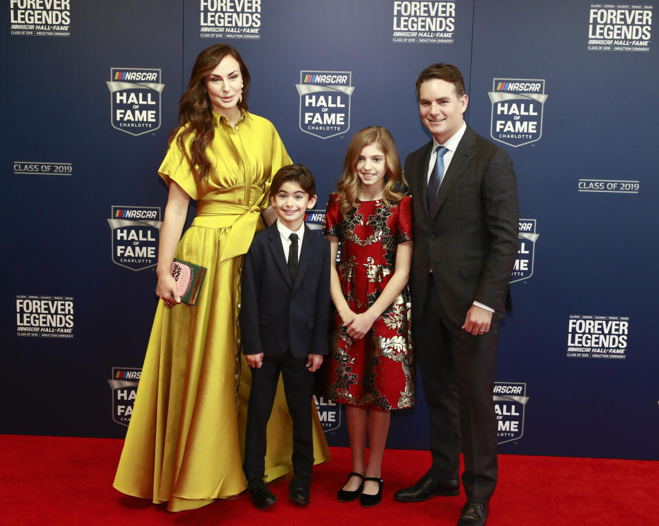 Former NASCAR driver Jeff Gordon, right, and his family from left: Ingrid Vandebosch, son Leo Benjamin and daughter Ella Sofia pose for photos before the NASCAR Hall of Fame induction ceremony for the Class of 2019, Friday, Feb. 1, 2019, in Charlotte, N.C. (AP Photo/Jason E. Miczek)