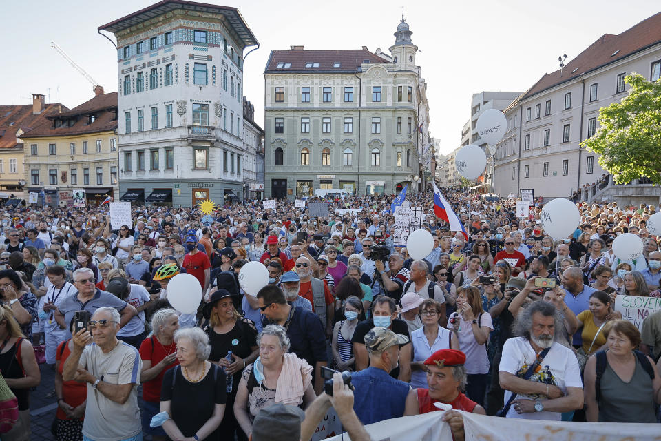 In this Friday, June 25, 2021 file photo, protesters rally during an anti-government demonstration in Ljubljana, Slovenia, Friday, June 25, 2021. Slovenia takes over the European Union presidency with its Prime Minister in the focus because of his squabbles with Brussels, alliance with populist Hungarian leader Viktor Orban and increasingly autocratic policies. All of these are casting doubt on the small country’s credibility to lead the 27-nation bloc. Although the rotating 6-month EU Council presidency, which Slovenia assumes from Portugal on Thursday, is mostly bureaucratic and to an extent symbolic, it comes amid the bloc’s painful post-COVID-19 recovery, the stalled EU enlargement process and concerns that the leadership role could be used by the government to further obstruct media freedoms in Slovenia and elsewhere in Europe. (AP Photo, FIile)