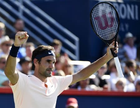 Aug 12, 2017; Montreal, Quebec, Canada; Roger Federer of Switzerland reacts after defeating Robin Haase of the Netherlands (not pictured) during the Rogers Cup tennis tournament at Uniprix Stadium. Mandatory Credit: Eric Bolte-USA TODAY Sports