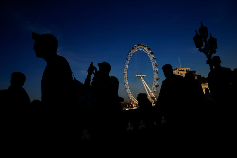 FILE PHOTO: People walk across Westminster Bridge in central London, Britain February 22, 2019. REUTERS/Henry Nicholls