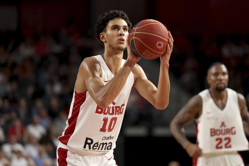 Zaccharie Risacher, of Bourg-en-Bresse, shoots a free throw during a Betclic Elite basketball game against Limoges in Bourg-en-Bresse, eastern France, on Oct. 31, 2023. New names will soon adorn replica NBA jerseys of French youths competing on basketball courts around Paris. Frenchmen Zaccharie Risacher, Alexandre Sarr and Tidjane Salaün are among the top picks in the NBA draft, where a second straight French No. 1 pick is expected after Victor Wembanyama last year. (AP Photo, File)