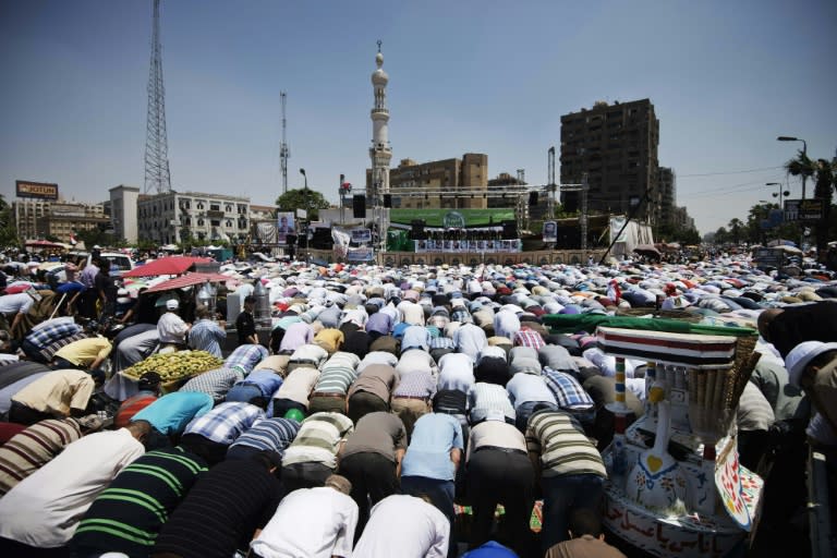 Thousands of Islamists and Muslim Brotherhood supporters perform the Friday prayers as they gather at Rabaa al-Adawiya mosque to start an open-ended sit-in in support of the legitimacy of President Mohamed Morsi in Cairo on June 28, 2013