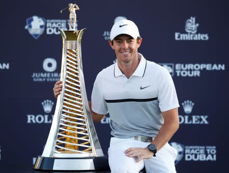 Golf - DP World Tour Championship - Jumeirah Golf Estates, Dubai, United Arab Emirates - 22/11/15 Northern Ireland's Rory McIlroy celebrates with the trophy after winning The Race to Dubai Action Images via Reuters / Paul Childs Livepic