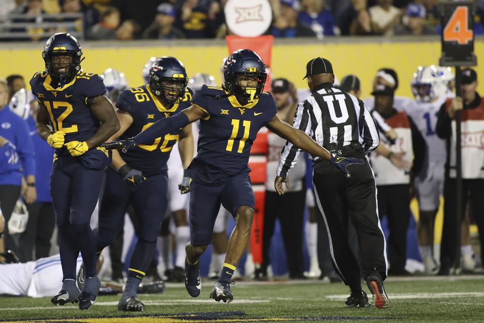 West Virginia’s Beanie Bishop (11) celebrates breaking up a pass during the first half of an NCAA college football game against BYU on Saturday, Nov. 4, 2023, in Morgantown, W.Va. West Virginia won 37-7. | Chris Jackson, Associated Press