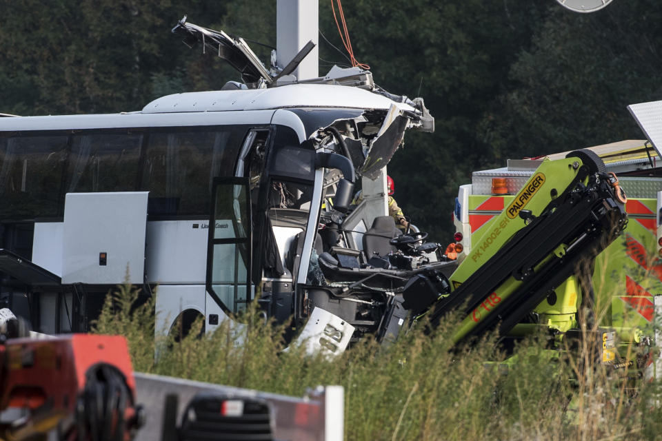 The accident site of a bus that crashed into signal post on the highway A2 in Sigirino, canton of Ticino, Switzerland, Sunday, Oct. 14, 2018. The A2 highway between Rivera and Lugano-North in is closed to the south. Several people were injured in the accident. (Gabriele Putzu, Ti-Press/Keystone via AP)