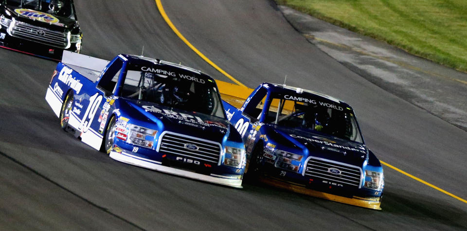 Austin Cindric, driver of the #19 LTi Printing Ford, and Chase Briscoe, driver of the #29 Cooper Standard Ford, lead a pack of trucks at Kentucky Speedway on July 6, 2017 in Sparta, Kentucky. (Getty Images)