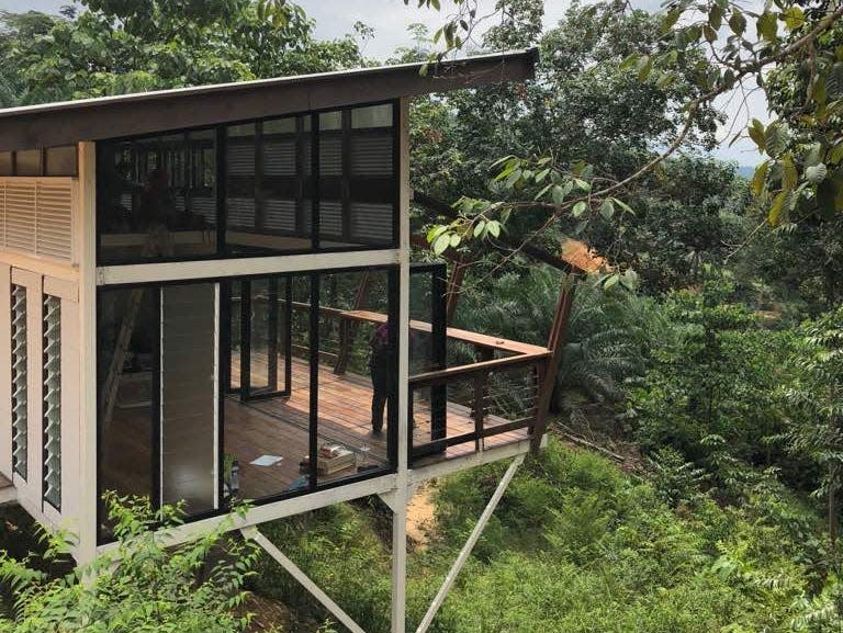 The tiny house offers a panoramic view of the Malaysian jungle.