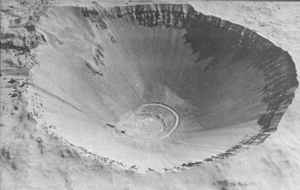 A black and white picture shows the crater created by the Sedan explosion