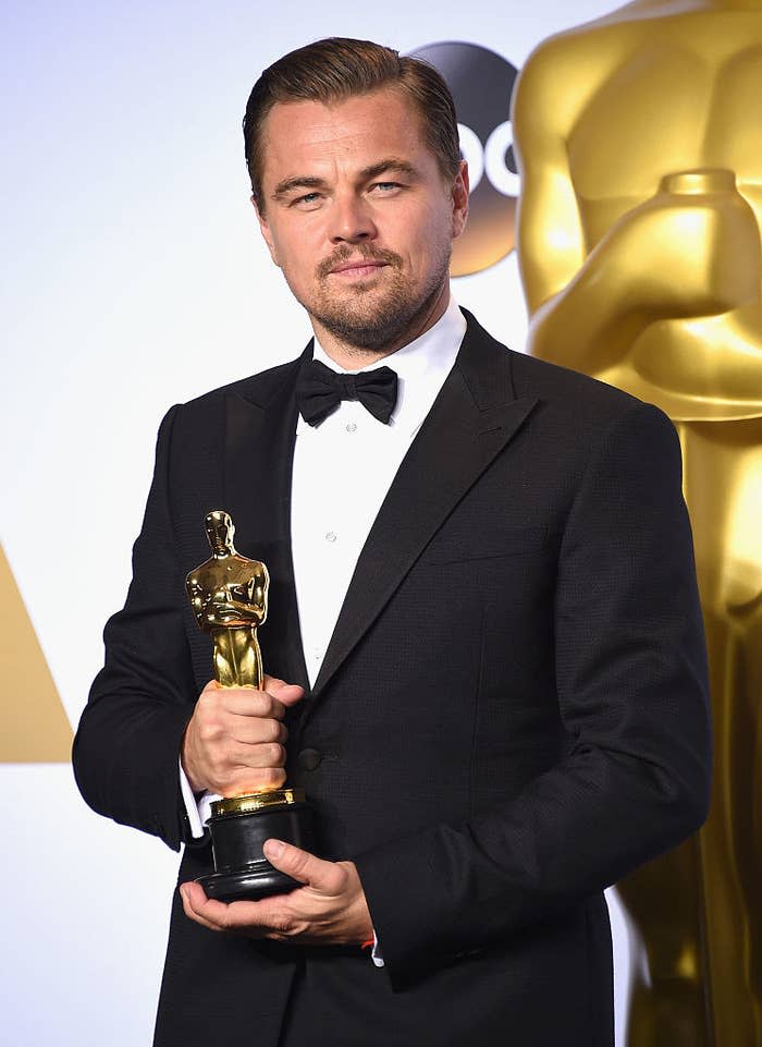 Leonardo holding an Oscar