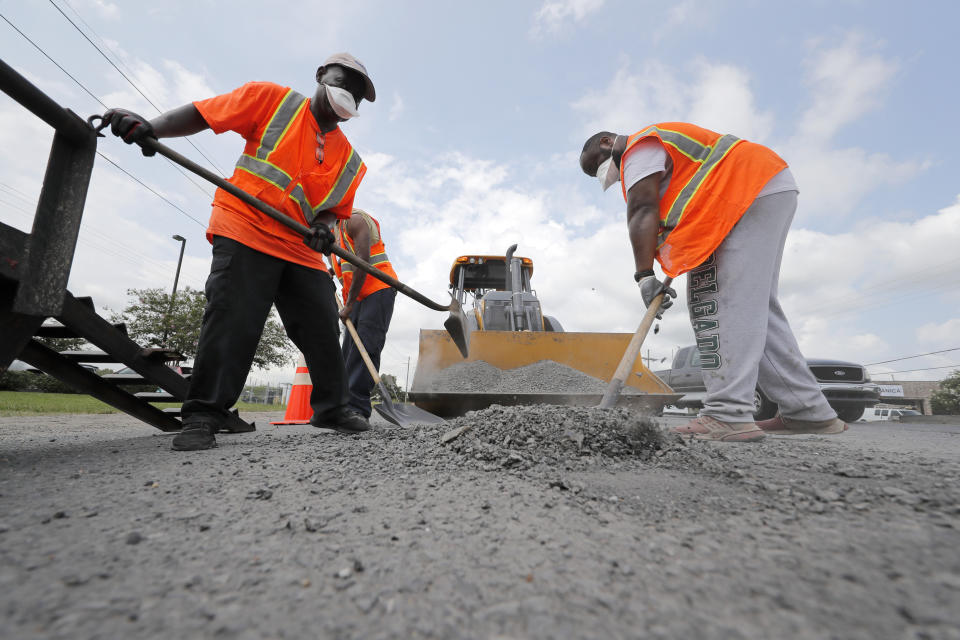 Construction workers from the Louisiana Department of Transportation and Development work in the heat on a road grading project on Airline Highway in St. Rose, La., Tuesday, Aug. 13, 2019. Forecasters say most of the South, from Texas to parts of South Carolina, will be under heat advisories and warnings as temperatures will feel as high as 117 degrees. (AP Photo/Gerald Herbert)