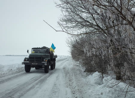 A military vehicle travels near the government-held industrial town of Avdiyivka, Ukraine, February 6, 2017. REUTERS/Gleb Garanich